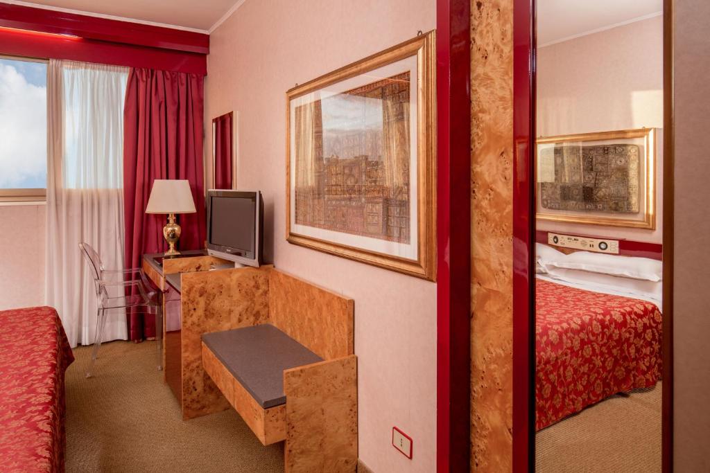 Postel nebo postele na pokoji v ubytování Enea Hotel Pomezia