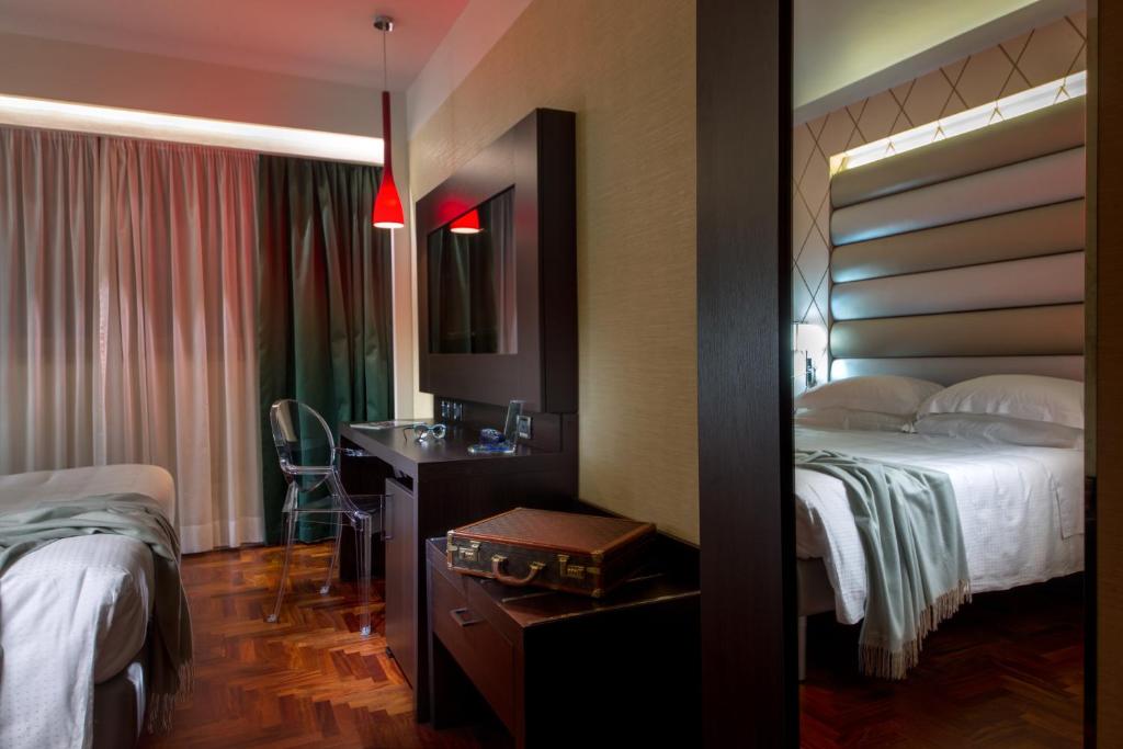 Postel nebo postele na pokoji v ubytování Enea Hotel Pomezia