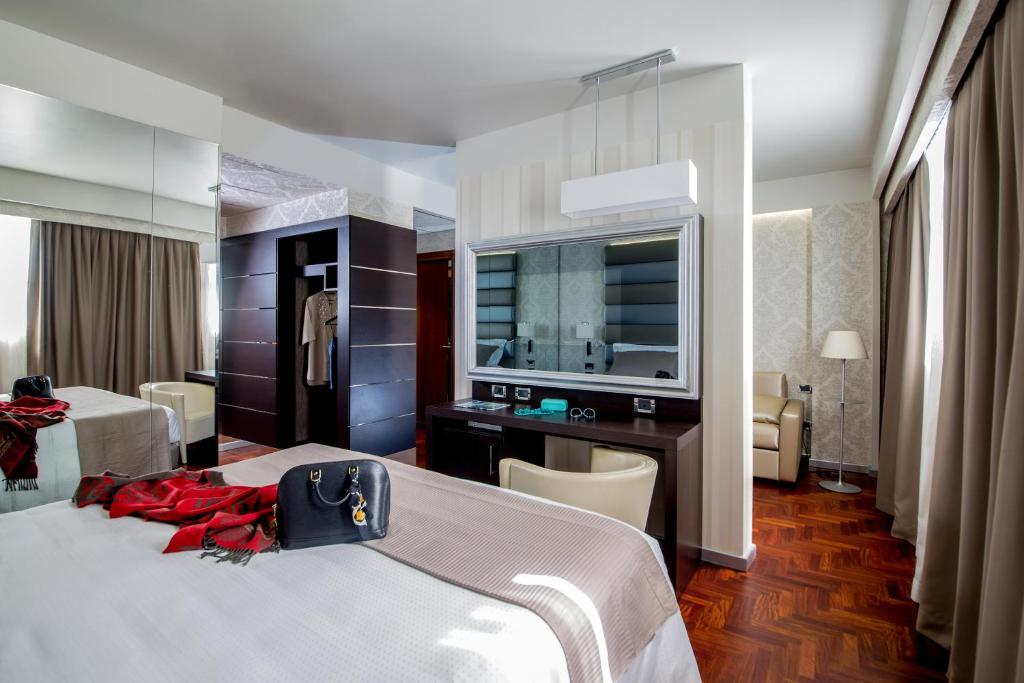 Postel nebo postele na pokoji v ubytování Enea Hotel Pomezia