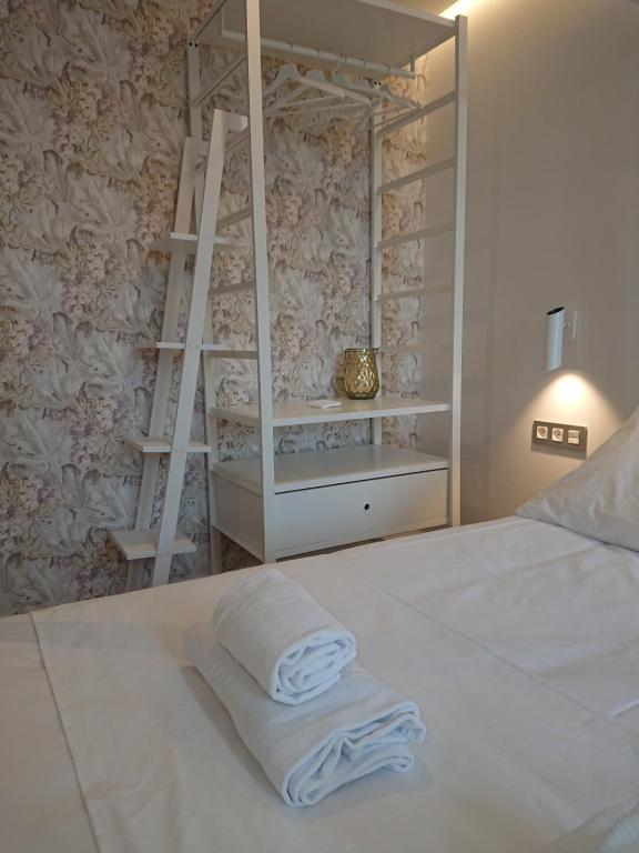 Postel nebo postele na pokoji v ubytování Hotel San Nikolas Sea Views
