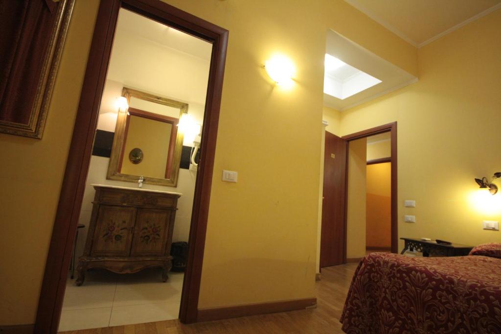 Postel nebo postele na pokoji v ubytování Hotel Termini