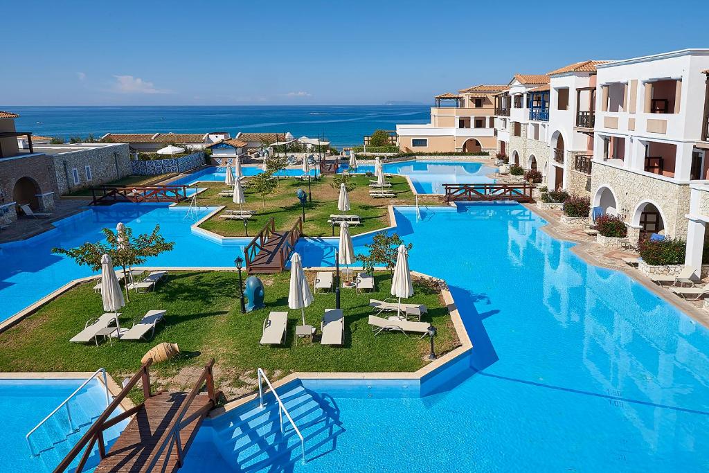 an aerial view of a resort with two pools at Aldemar Olympian Village in Olympia