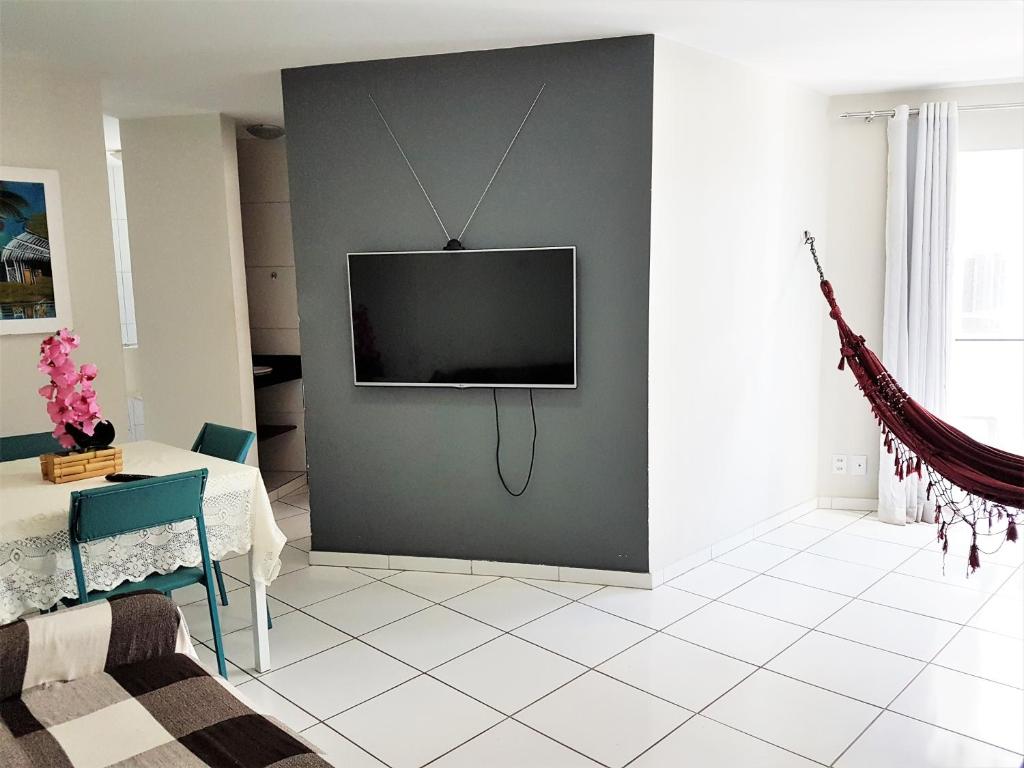 TV a/nebo společenská místnost v ubytování Apart Cote D'Azur Maceió