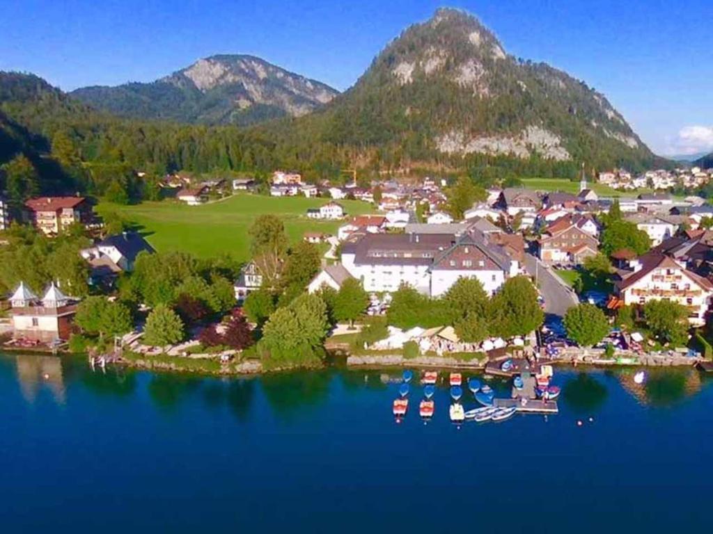 an aerial view of a resort on a lake at Seehotel Schlick in Fuschl am See