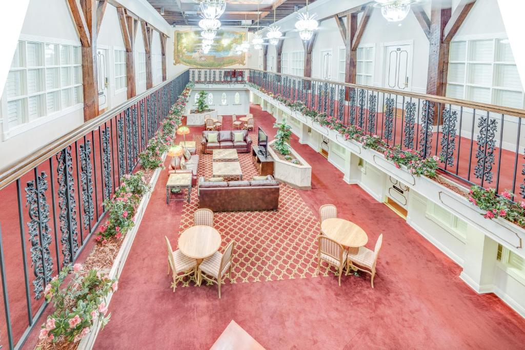 an overhead view of a balcony with tables and chairs at Plaza Suites Downtown New Orleans in New Orleans
