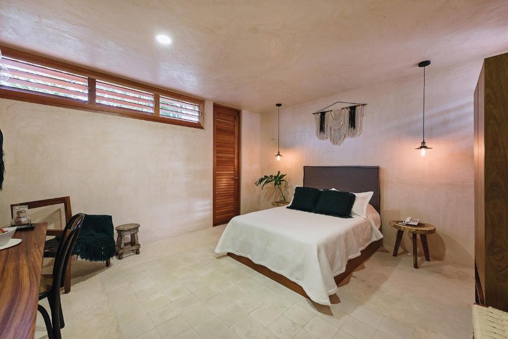 Uma cama ou camas num quarto em Colonte Hotel Origen