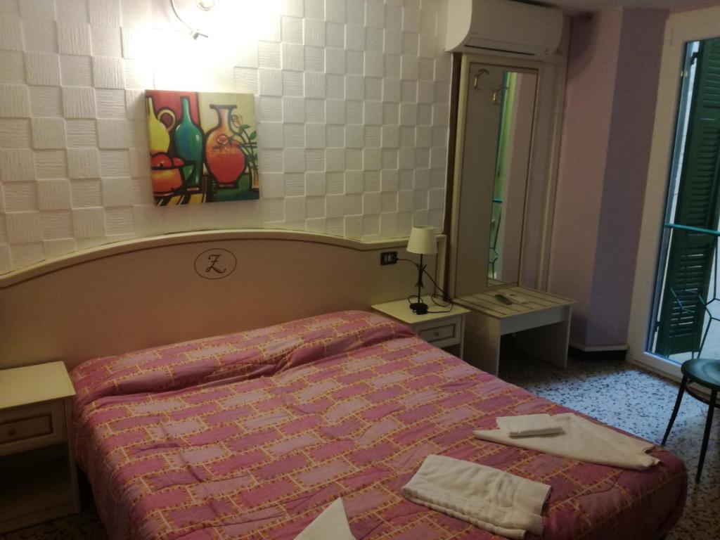 Postel nebo postele na pokoji v ubytování Hotel La Zorza
