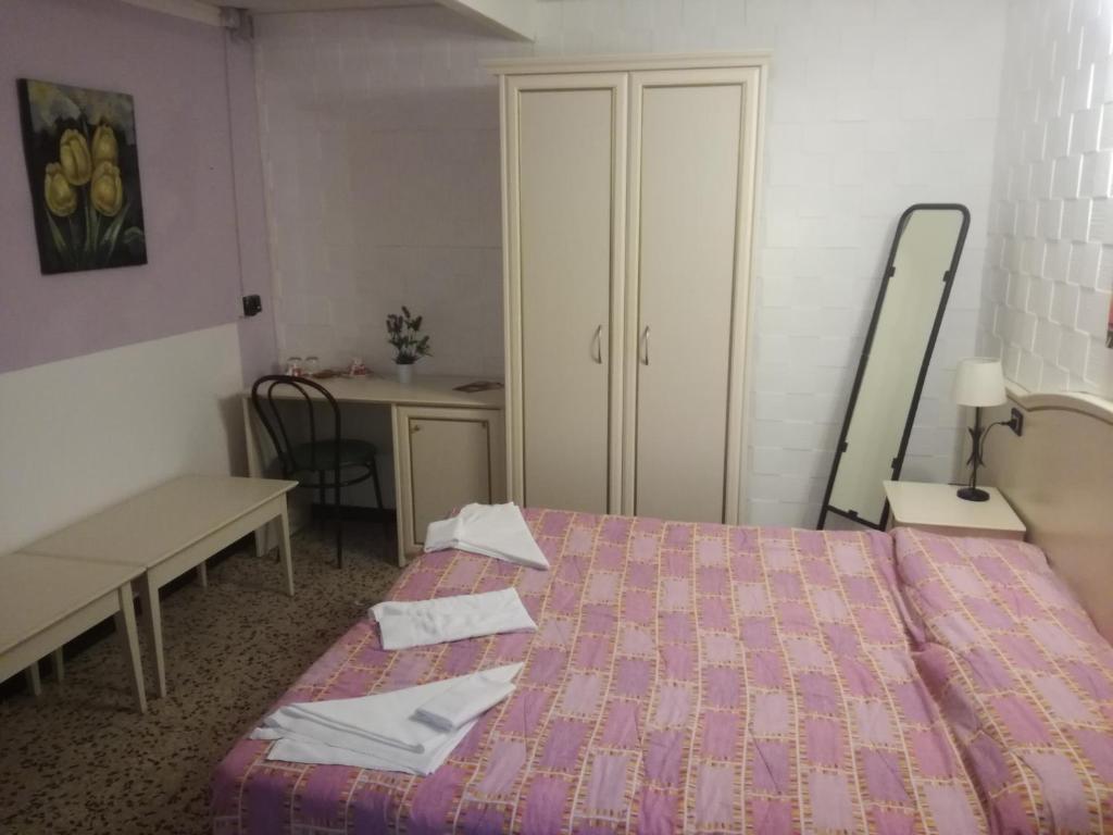 Postel nebo postele na pokoji v ubytování Hotel La Zorza