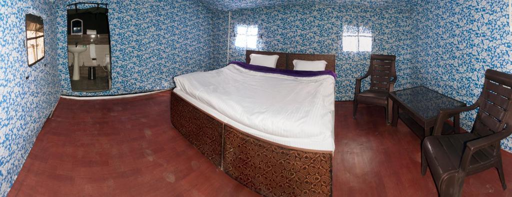 Postel nebo postele na pokoji v ubytování Jungle Stays