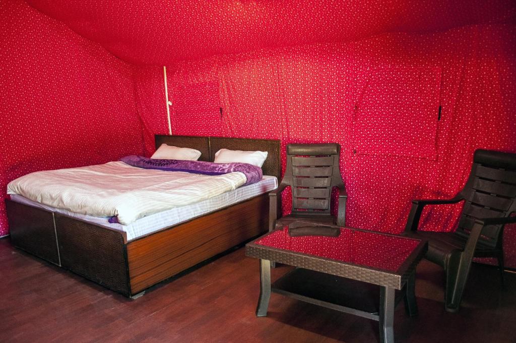 Postel nebo postele na pokoji v ubytování Jungle Stays
