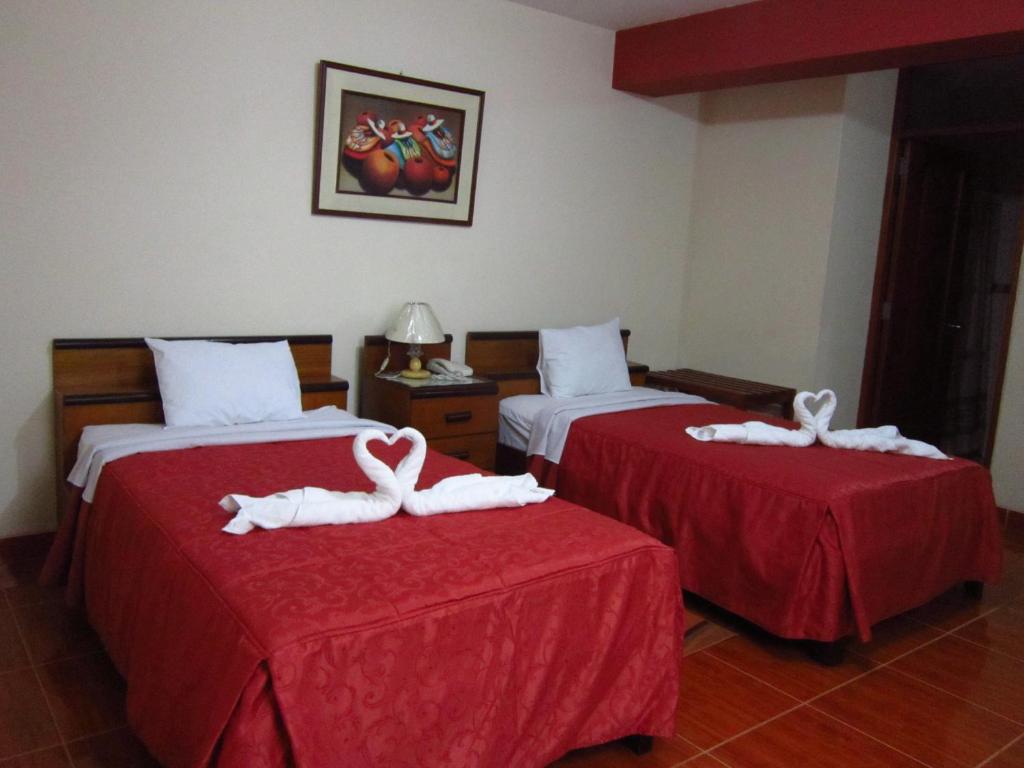 Postel nebo postele na pokoji v ubytování Hotel Plaza Bolognesi 344