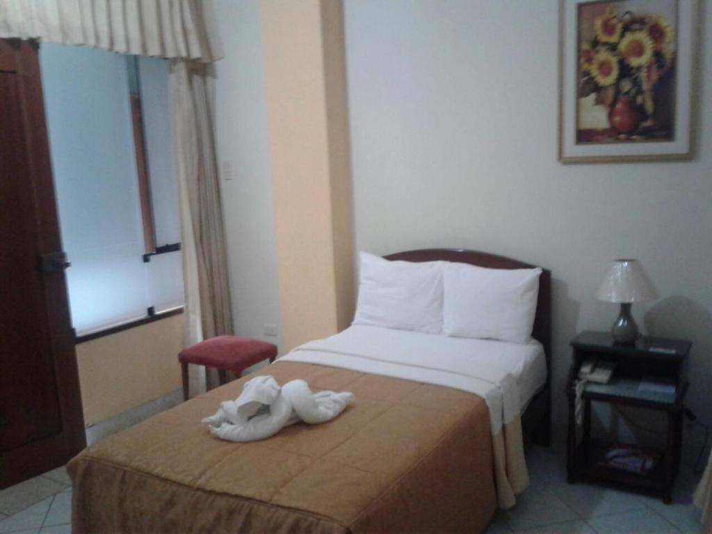 Postel nebo postele na pokoji v ubytování Hotel Plaza Bolognesi 344
