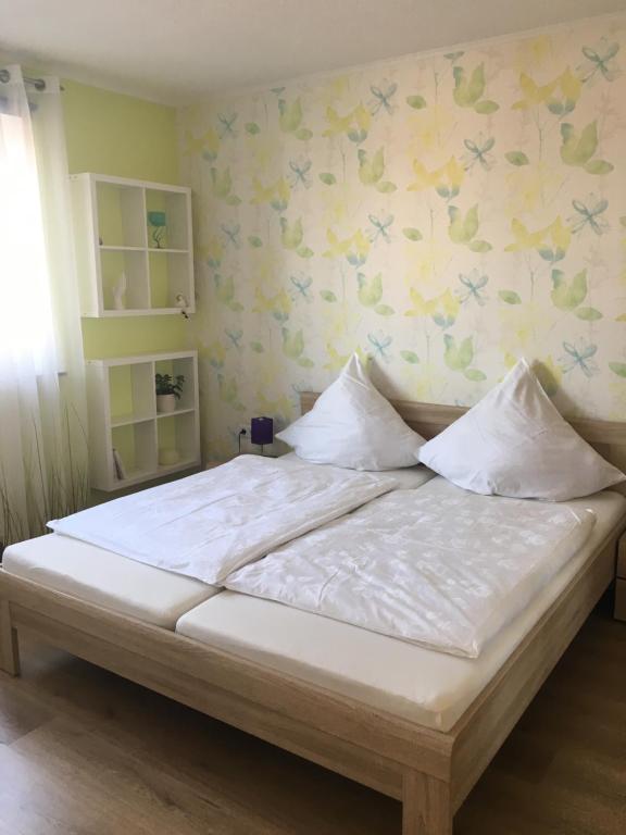 Postel nebo postele na pokoji v ubytování Ferienwohnung am DOC
