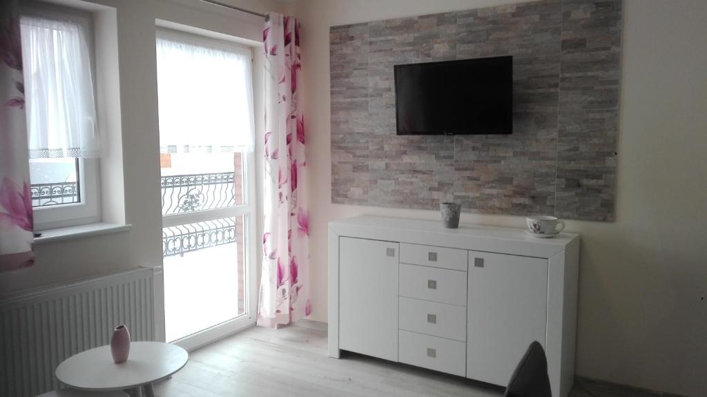 TV a/nebo společenská místnost v ubytování Apartamenty u" Lusi"