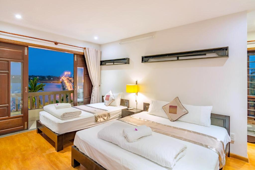 Postel nebo postele na pokoji v ubytování B'Lan Riverside Villa