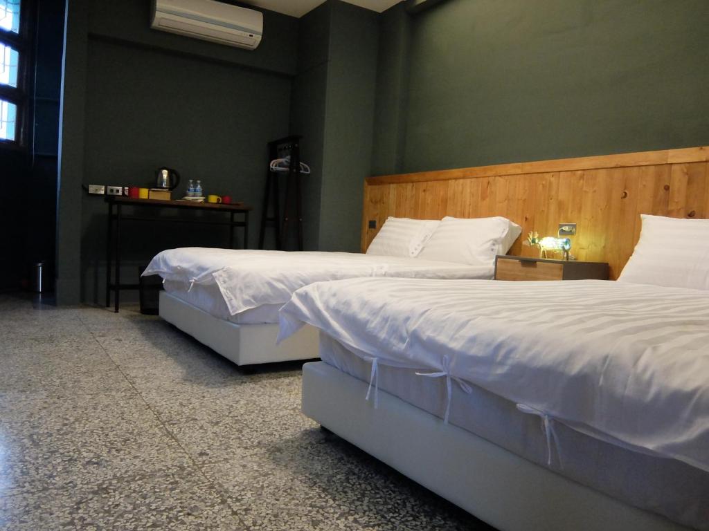 Postel nebo postele na pokoji v ubytování Xin Yuan Hang Homestay