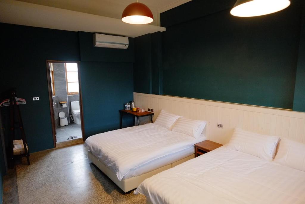 Postel nebo postele na pokoji v ubytování Xin Yuan Hang Homestay