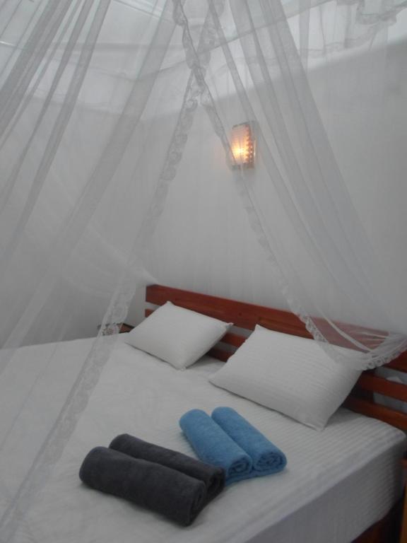 Postel nebo postele na pokoji v ubytování Sky Garden Ella