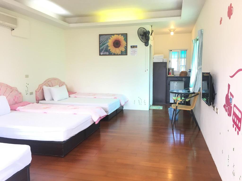 Postel nebo postele na pokoji v ubytování Chin Shan B&B