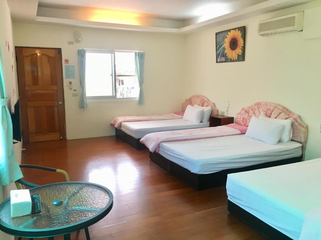 Postel nebo postele na pokoji v ubytování Chin Shan B&B