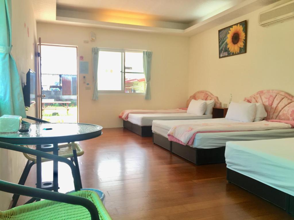 Postel nebo postele na pokoji v ubytování Chin Shan B&B