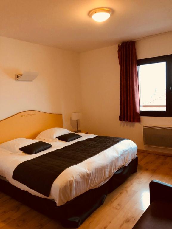 Postel nebo postele na pokoji v ubytování Le Champ des Lys
