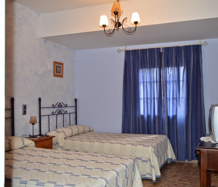 Postel nebo postele na pokoji v ubytování Posada La Reja