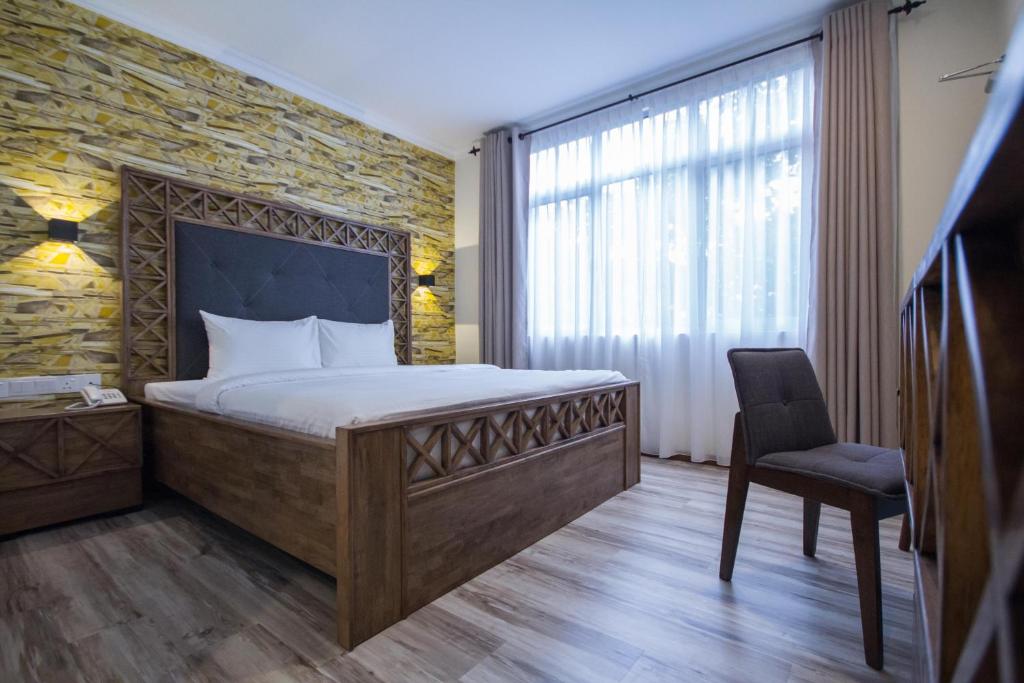 A bed or beds in a room at Wifi Boutique Hotel