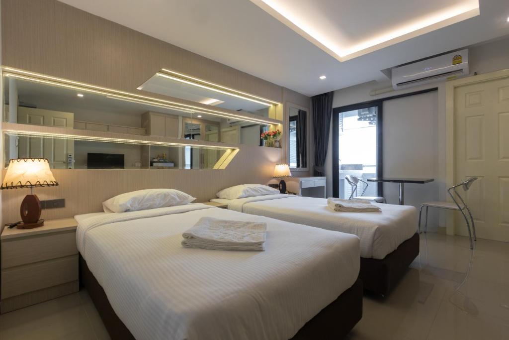 เตียงในห้องที่ B-your home Hotel Don Mueang Airport Bangkok