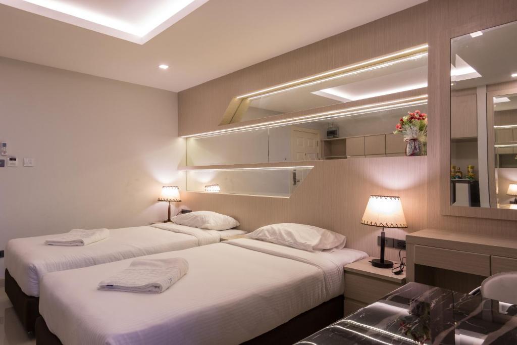 เตียงในห้องที่ B-your home Hotel Don Mueang Airport Bangkok