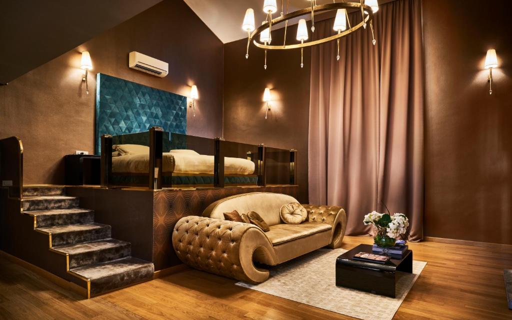 a living room with a couch and two beds at Penthouse Suite Rome - Private Suites in Rome