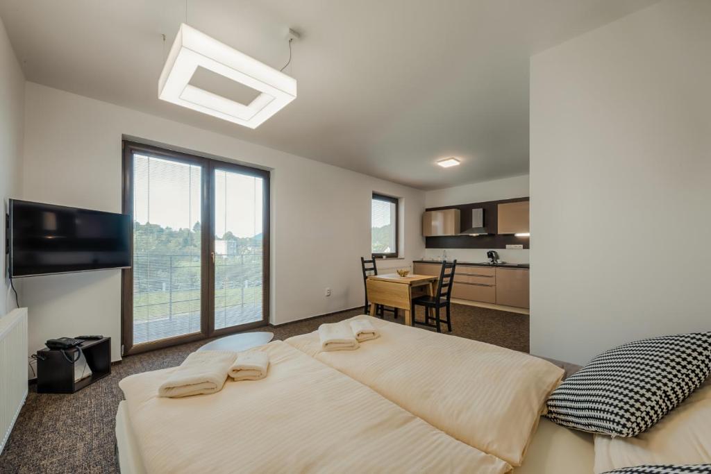 Postel nebo postele na pokoji v ubytování Village Resort Hanuliak Apartmany