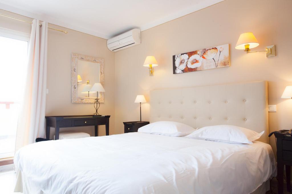 Postel nebo postele na pokoji v ubytování Hotel Macchia e Mare