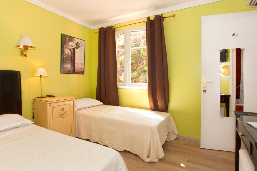 Postel nebo postele na pokoji v ubytování Hotel Macchia e Mare