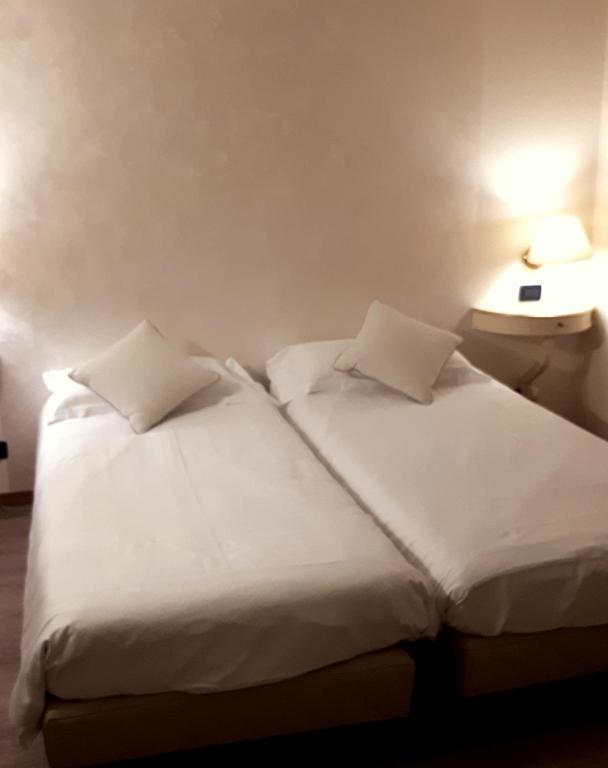 A bed or beds in a room at Cà Doge