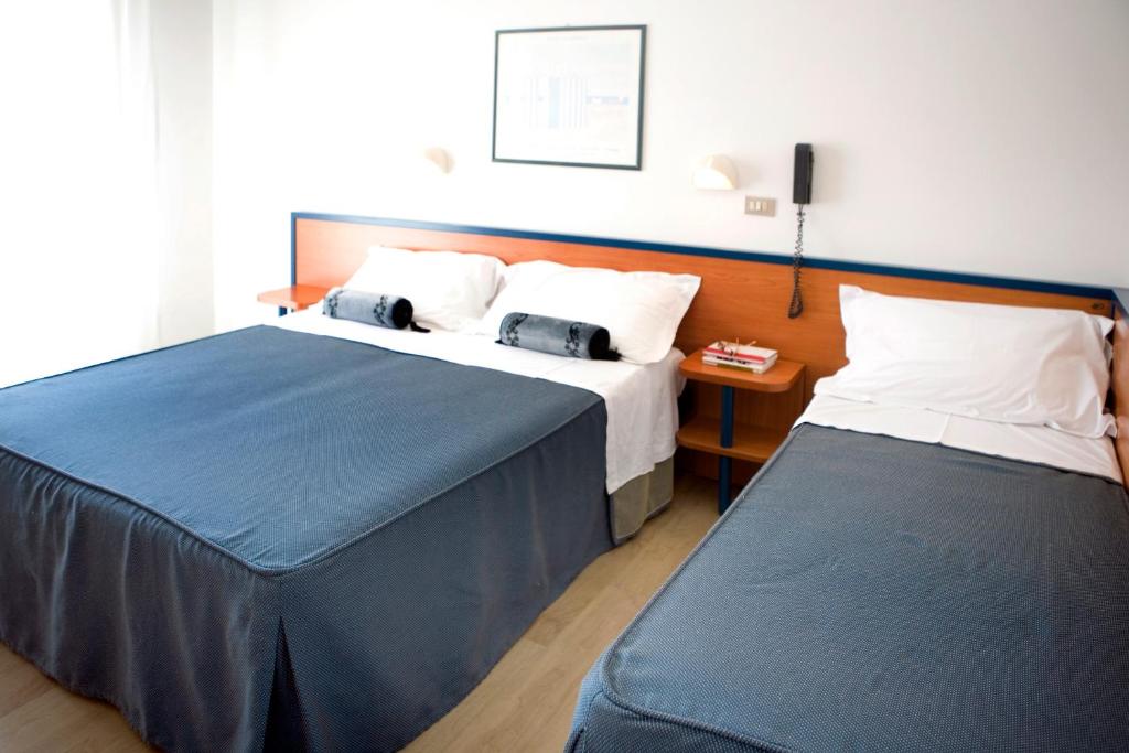 Postel nebo postele na pokoji v ubytování Hotel Tiffany & Resort