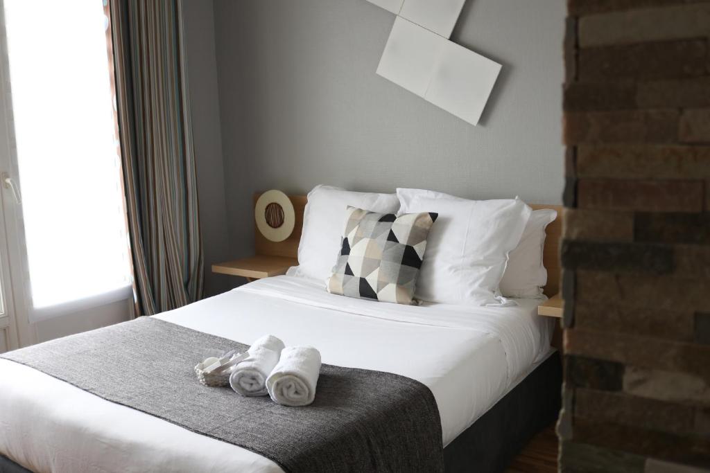 Postel nebo postele na pokoji v ubytování Hotel Le Transat Bleu