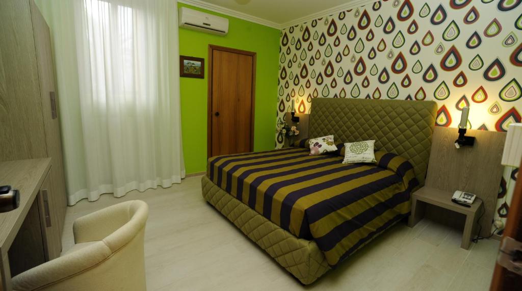 Postel nebo postele na pokoji v ubytování Hotel Tropical