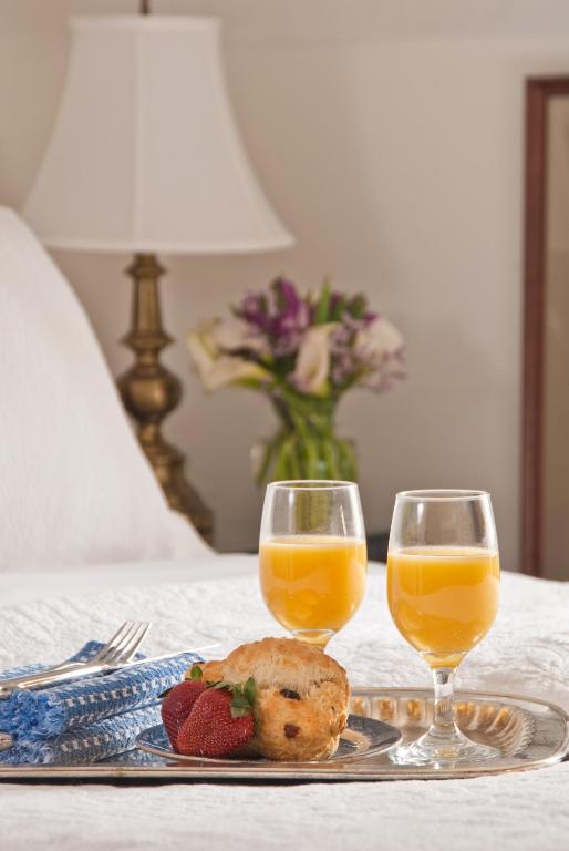 a plate of food and two glasses of orange juice at Marshall Slocum Inn in Newport