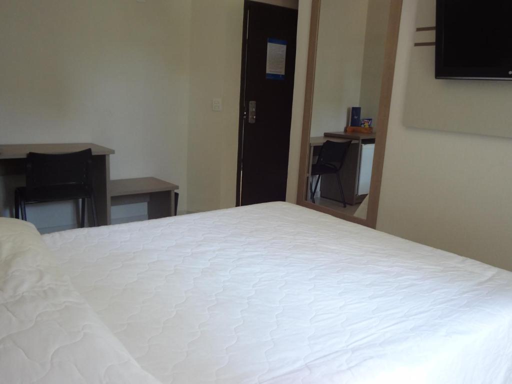 Postel nebo postele na pokoji v ubytování Iguassu Express Hotel