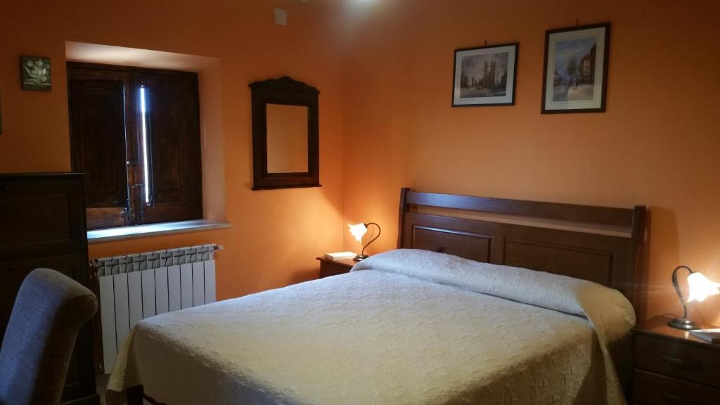 Postel nebo postele na pokoji v ubytování B&B A Robba de Pupi
