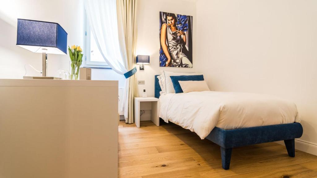 Postel nebo postele na pokoji v ubytování Cafe Bleu Relais