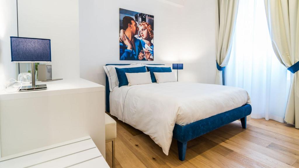 Postel nebo postele na pokoji v ubytování Cafe Bleu Relais