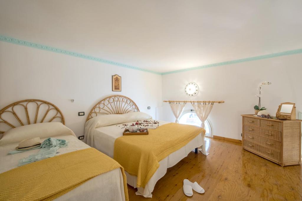 Posteľ alebo postele v izbe v ubytovaní Ricciolo d'oro 2
