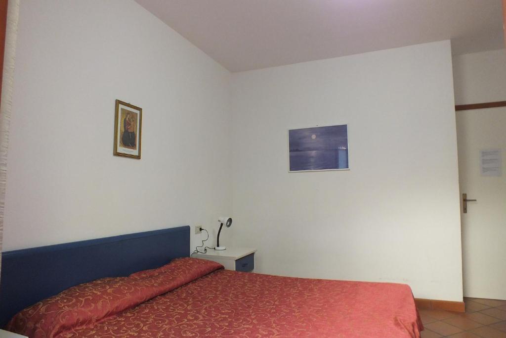 A bed or beds in a room at Le Soleil