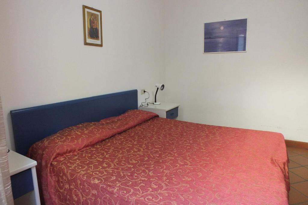 A bed or beds in a room at Le Soleil