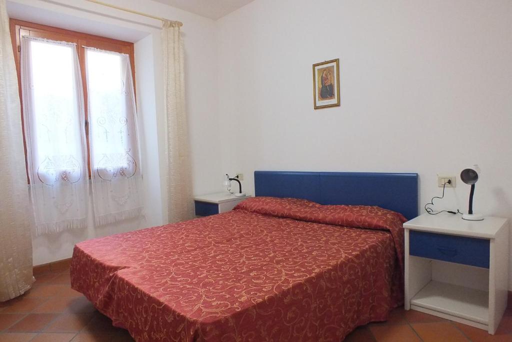 A bed or beds in a room at Le Soleil
