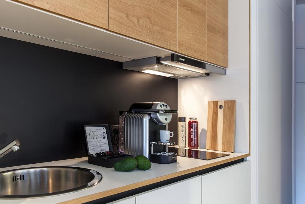 Kuchyň nebo kuchyňský kout v ubytování smartments Wien Hauptbahnhof - Serviced Apartments