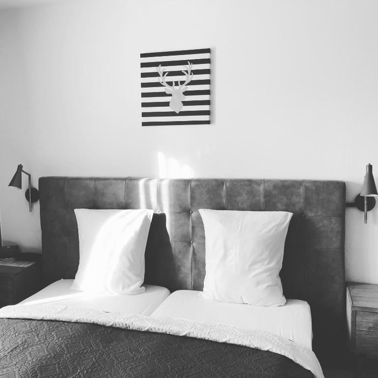Postel nebo postele na pokoji v ubytování Hotel De Fierlant