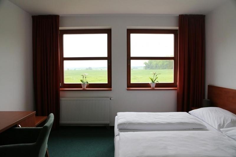 Cama o camas de una habitación en Sporthotel Hostivice